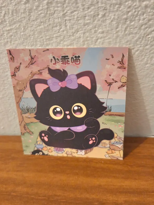 Figurina gatto nero con fiocco