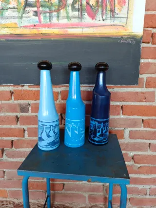 Tris bottiglie Dalì