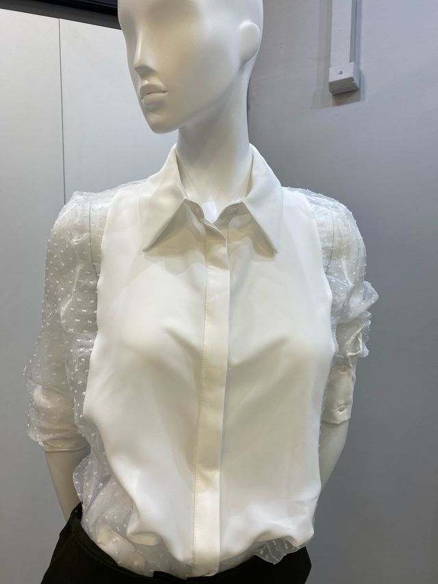 Blusa blanca elegante plumetti