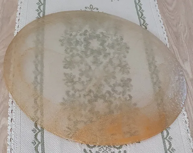 Piatto rotondo in vetro e polvere dorata
