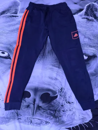 Pantalón chándal Adidas azul y naranja