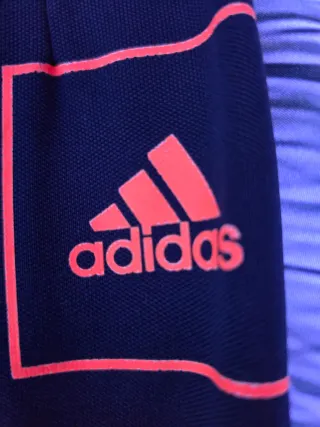 Pantalón chándal Adidas azul y naranja