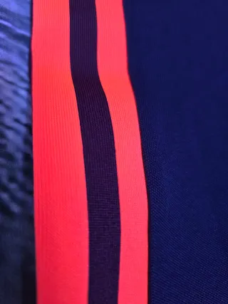 Pantalón chándal Adidas azul y naranja
