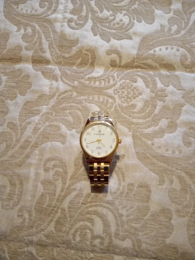 Reloj COLmar dorado y blanco