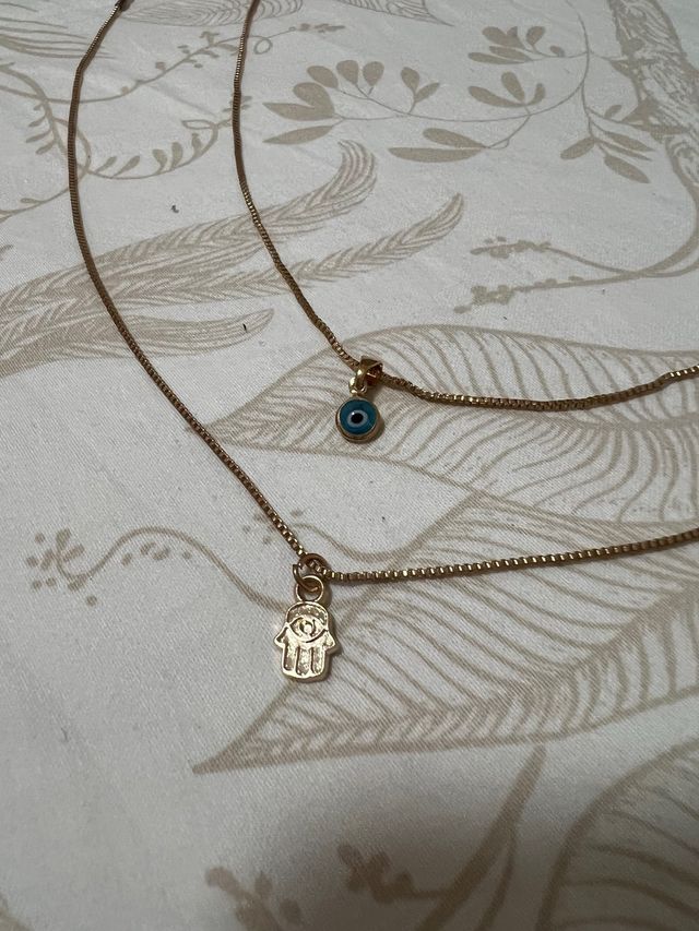 Confezione di 2 collane dorate con ciondoli