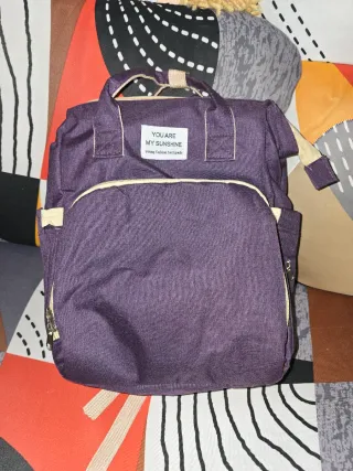 Mochila e muda fraldas roxa
