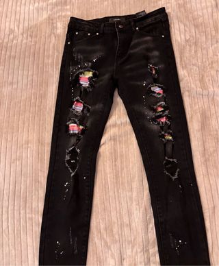 Jeans Amiri neri con schizzi