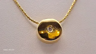 Colgante y cadena oro 18K con diamante
