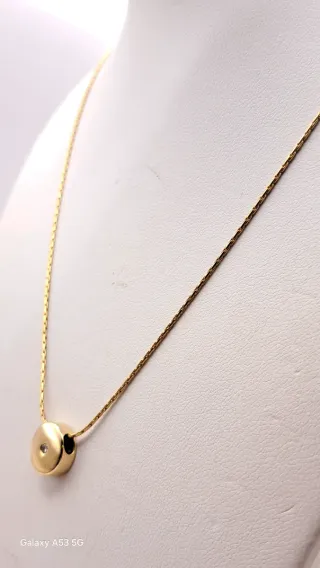 Colgante y cadena oro 18K con diamante