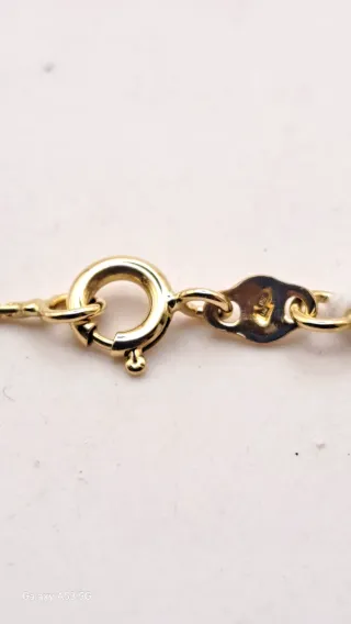 Colgante y cadena oro 18K con diamante