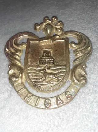 Insignia UMIGAS bronce-laton 13x12 ver