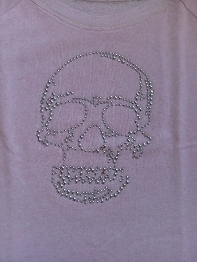 Jersey mujer rosa con calavera plateada