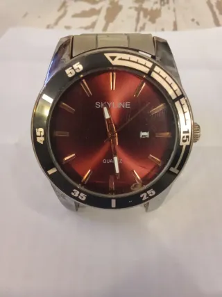Reloj Skyline Rojo y Plateado acero