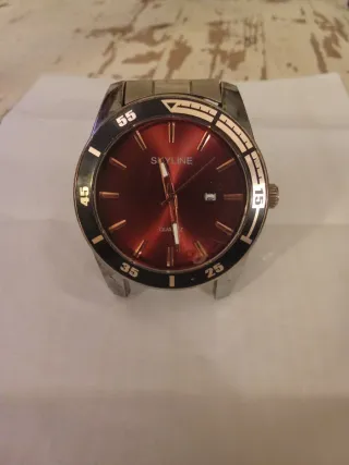 Reloj Skyline Rojo y Plateado acero