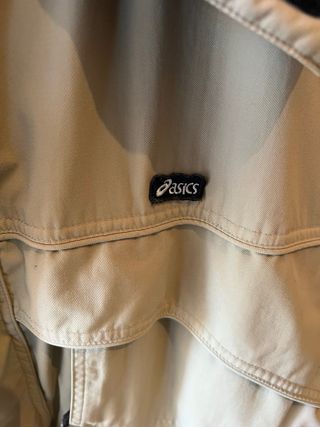 Giacca Asics beige e nera