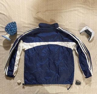 Giacca a vento Adidas blu e bianca