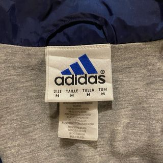 Giacca a vento Adidas blu e bianca