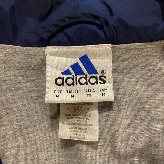 Giacca a vento Adidas blu e bianca