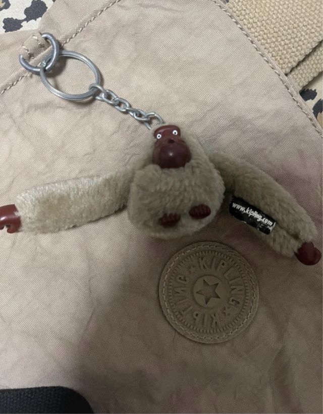 Borsetta Kipling grigia con scimmietta