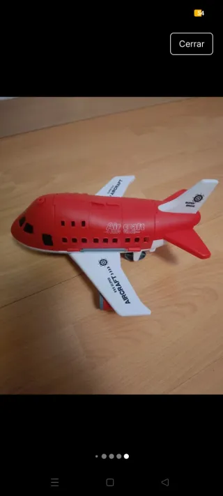 Avión de juguete rojo y blanco