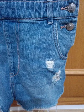 Peto corto vaquero desgastado