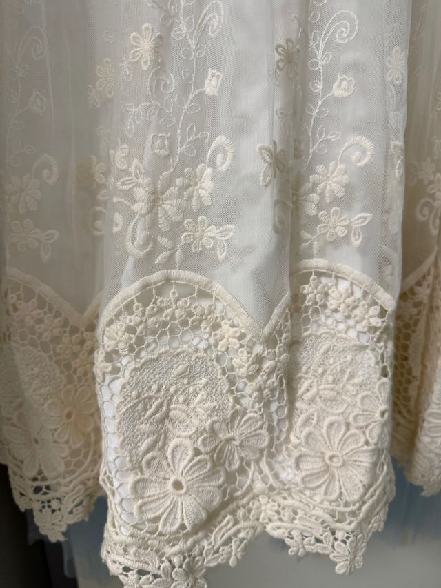 Vestido de comunión blanco con lazada celeste
