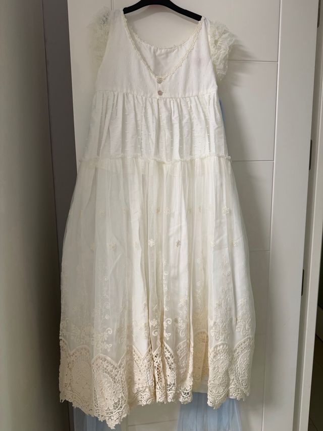 Vestido de comunión blanco con lazada celeste