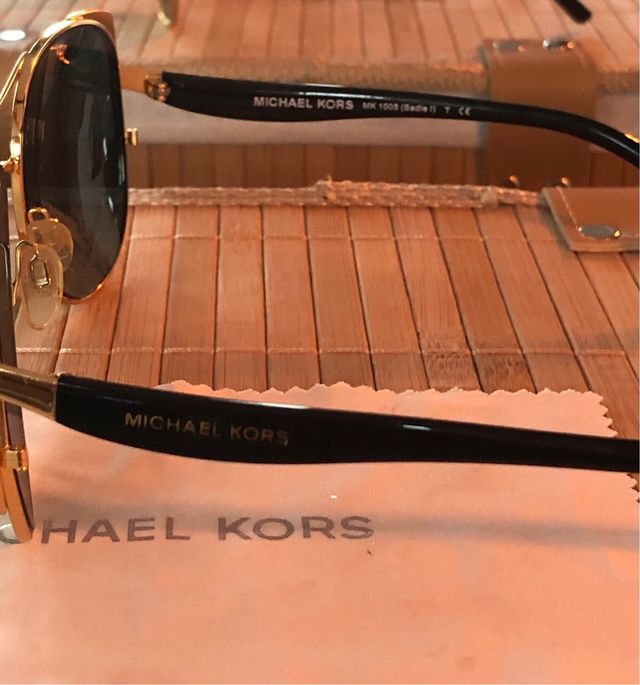 Occhiali da sole Michael Kors dorati e neri