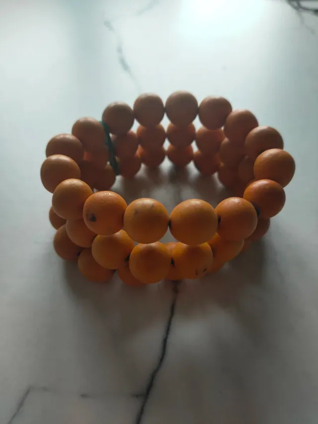 Braccialetto piccolo con perline arancioni