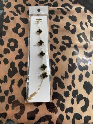 Pulsera tréboles oro y negro