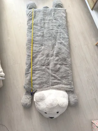 Saco de dormir de peluche.