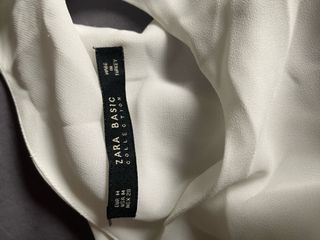 Blusa blanca sin mangas espalda abierta