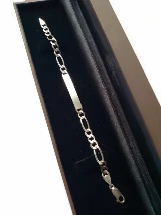 Esclava de plata con placa.largo 18.60 cm.