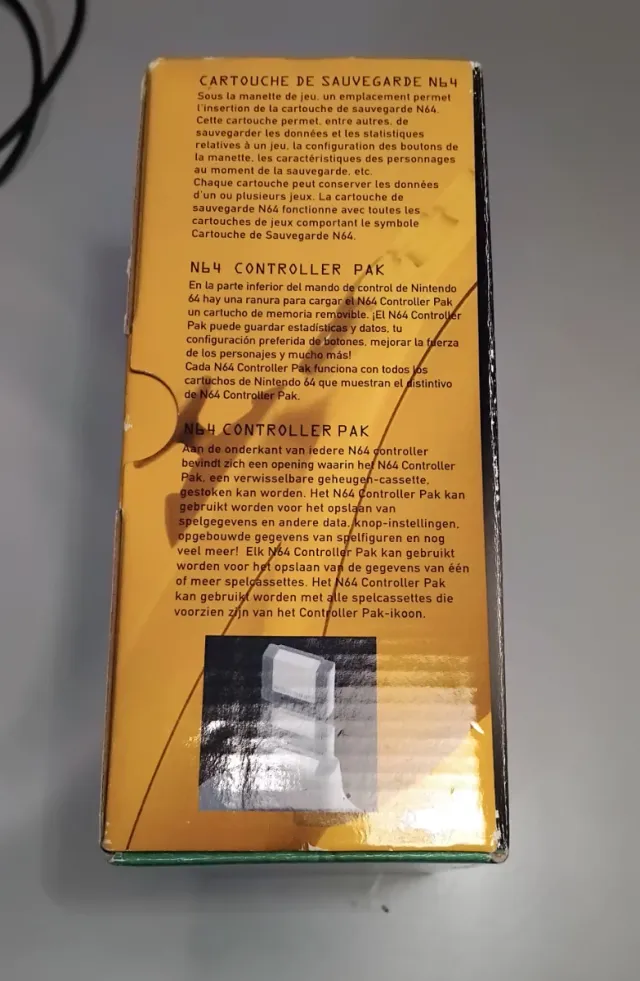 Mando N64 con caja y papeles