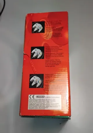 Mando N64 con caja y papeles