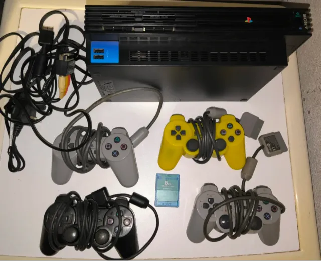 Consola PlayStation 2 con mandos y accesorios