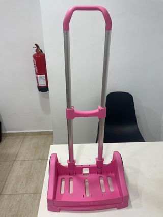 Porta mochila rosa en buen estado.