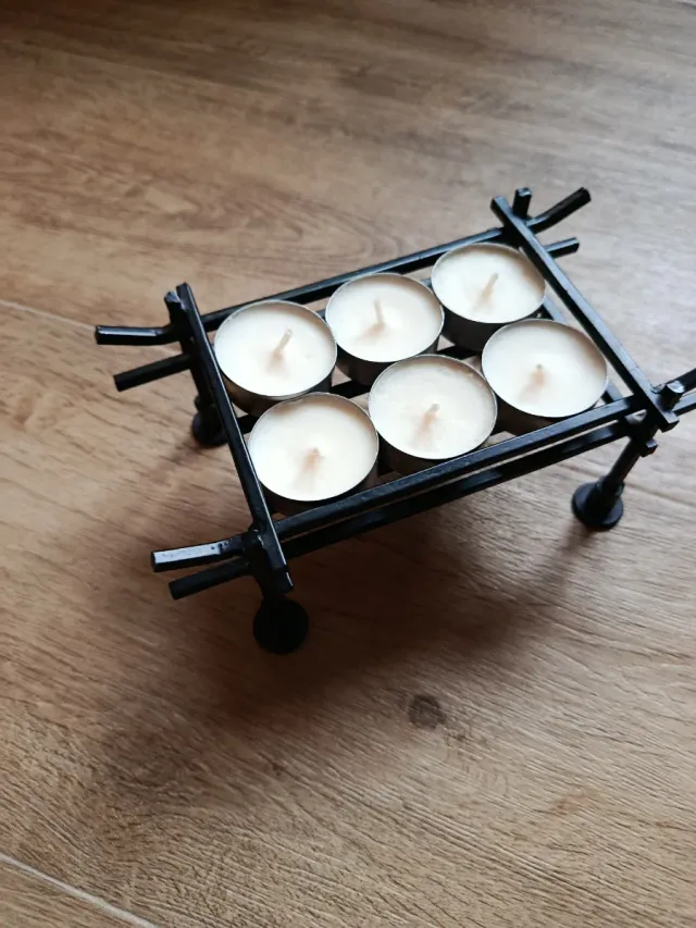 Portavelas de metal negro