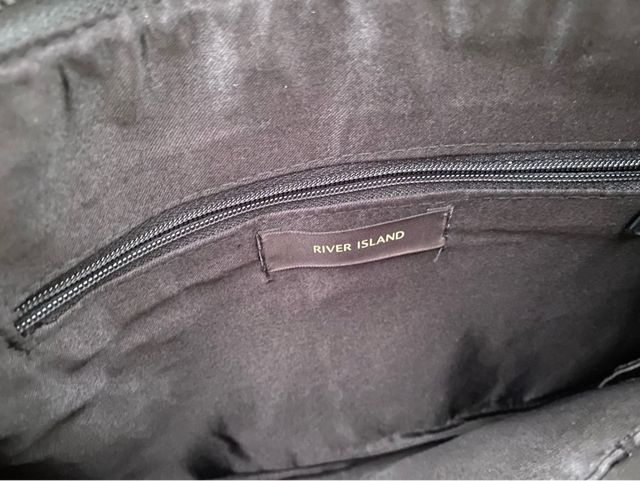 Cartera de mano con palmeras