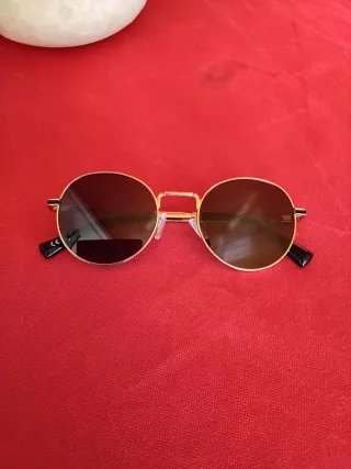 Gafas de sol Hawkers negras y doradas