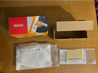 Nintendo 2DS XL Blanca Naranja en su caja perfecta