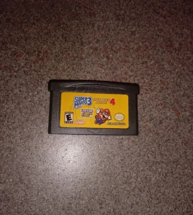 Game Boy Advance SP + Pokémon verde hoja y mario