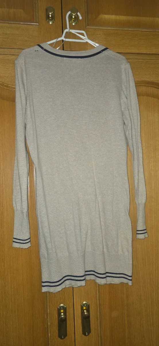 Rebeca beige con bolsillos