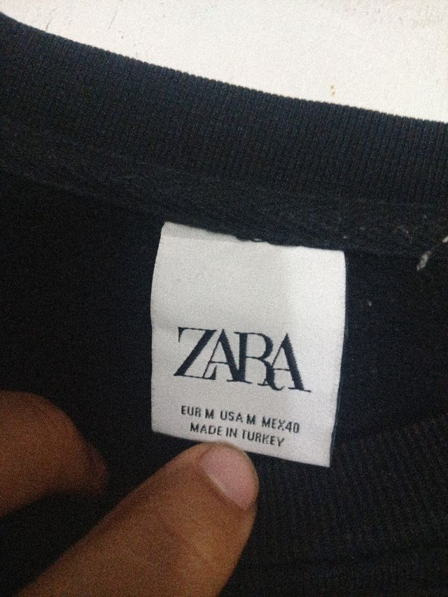 Jersey negro manga larga con bolsillo cuadros