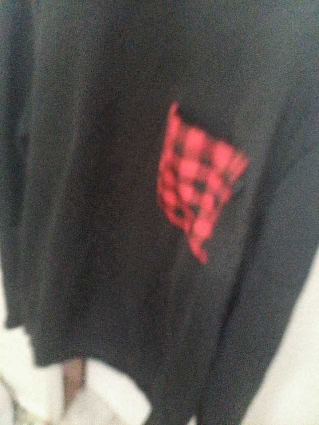 Jersey negro manga larga con bolsillo cuadros