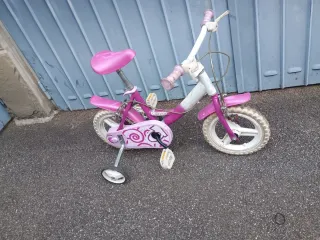 Bicicletta bambina rosa con rotelle