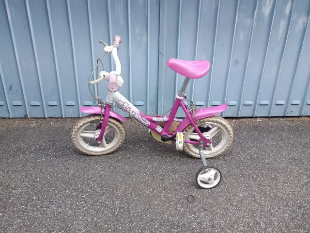 Bicicletta bambina rosa con rotelle