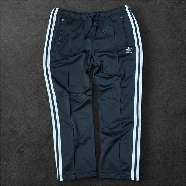 Pantaloni Adidas neri con zip