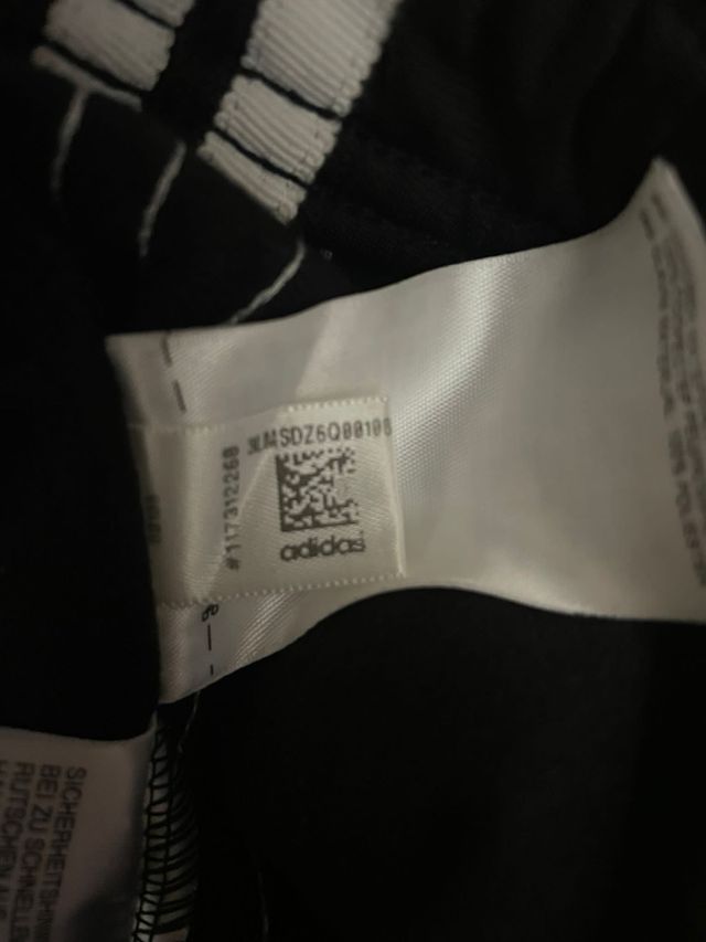 Pantaloni Adidas neri con zip