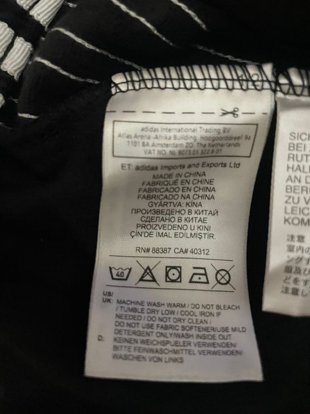 Pantaloni Adidas neri con zip